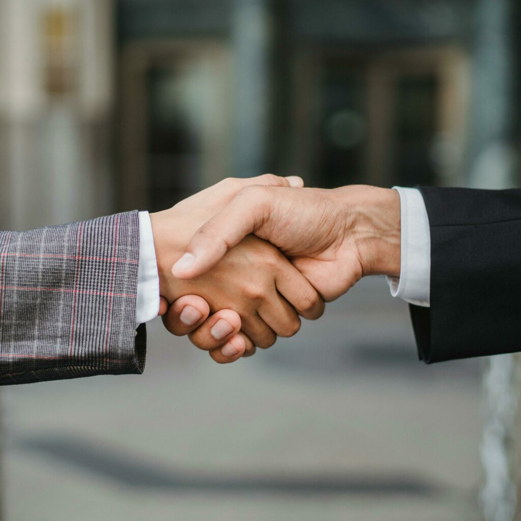 Two People Shaking Hands 